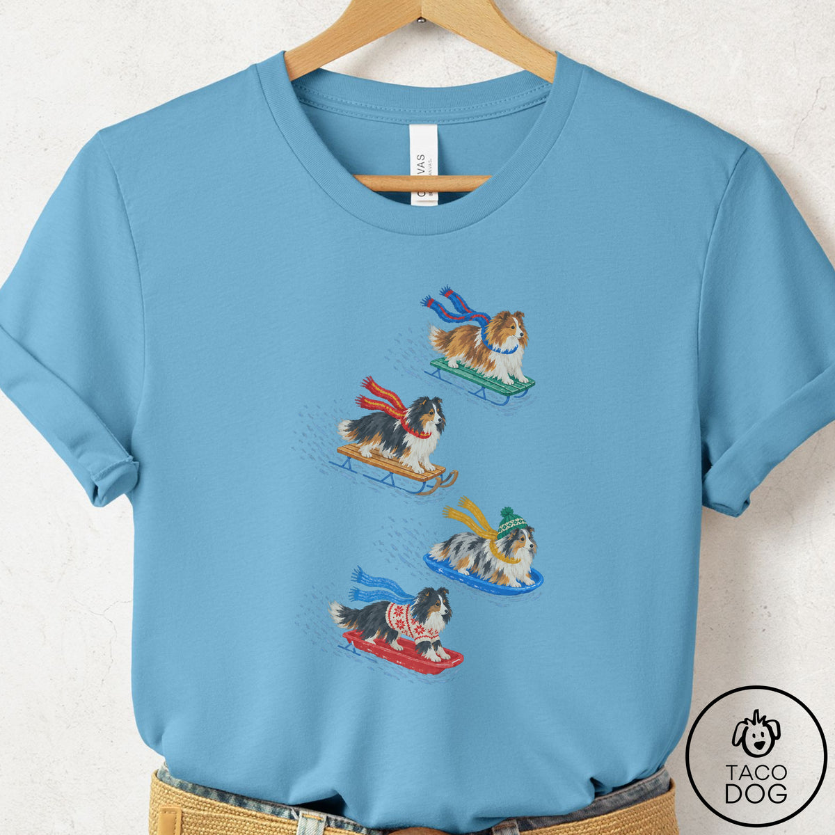 Shetland Sheepdog Sledding T-Shirt Ocean Blue Taco-Dog