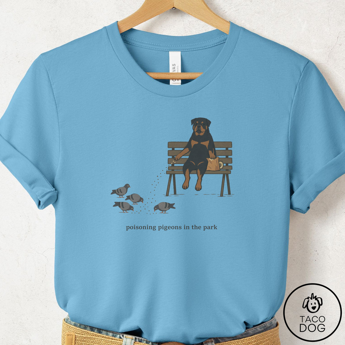 Rottweiler Pigeons in the Park T-Shirt Ocean Blue Taco-Dog