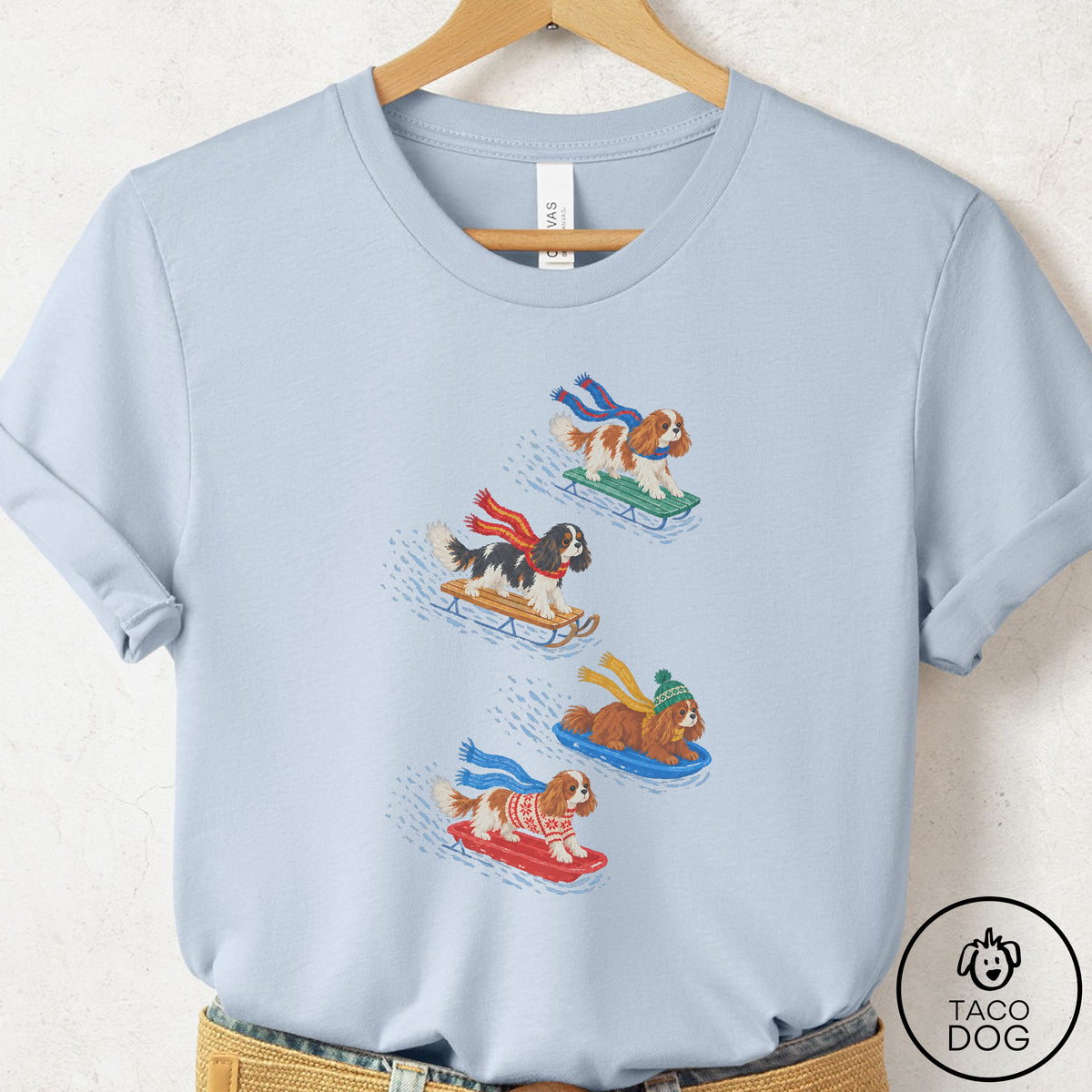 Cavalier King Charles Spaniel Sledding T-Shirt Light Blue Taco-Dog