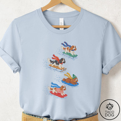 Cavalier King Charles Spaniel Sledding T-Shirt Light Blue Taco-Dog