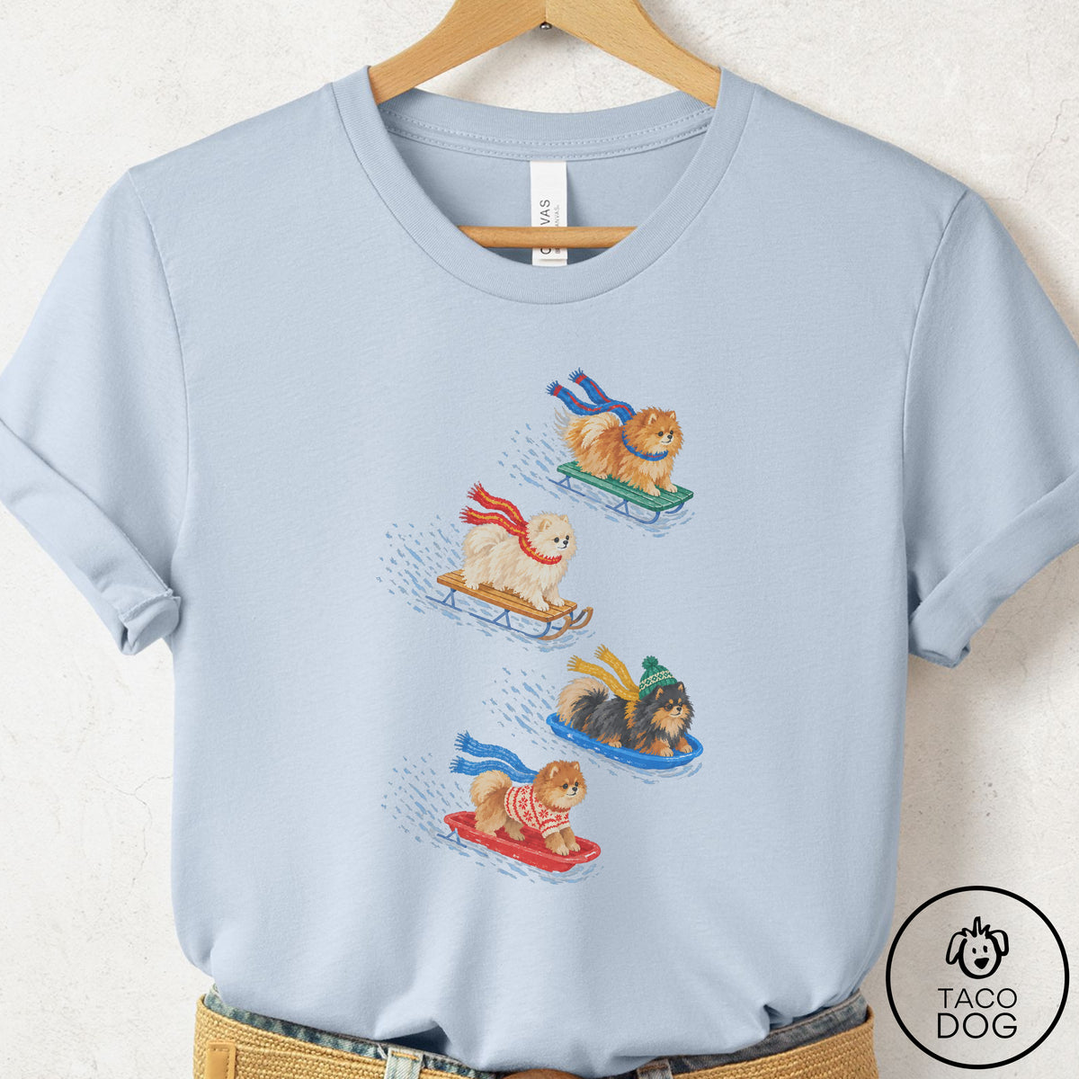 Pomeranian Sledding T-Shirt Light Blue Taco-Dog