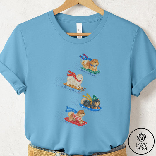 Pomeranian Sledding T-Shirt Ocean Blue Taco-Dog