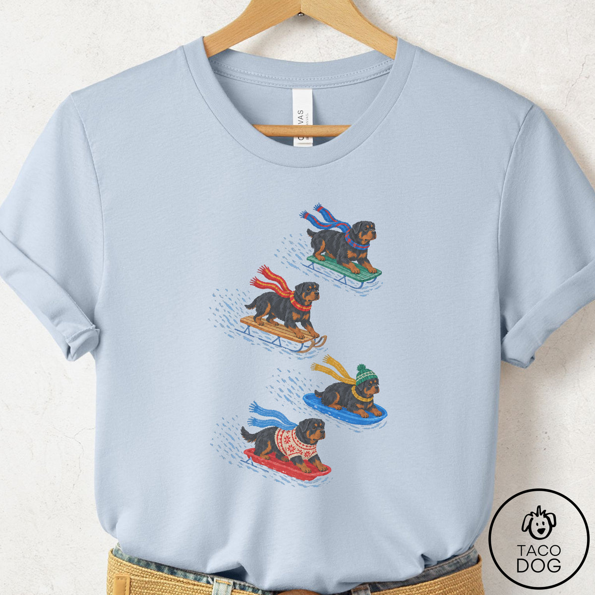 Rottweiler Sledding T-Shirt Light Blue Taco-Dog