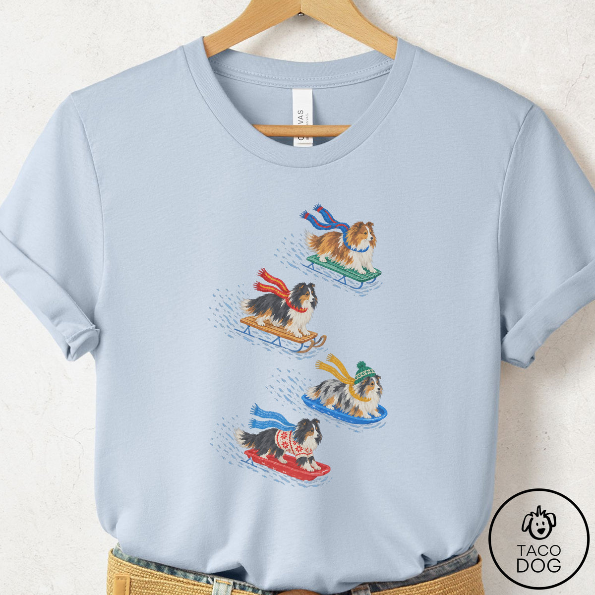 Shetland Sheepdog Sledding T-Shirt Light Blue Taco-Dog