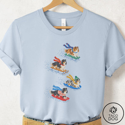 Shetland Sheepdog Sledding T-Shirt Light Blue Taco-Dog